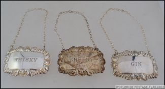 3 silver hallmarked decanter labels - Whisky, Sherry & Gin by P H Vogel & Co, Birmingham 1973, 1974.