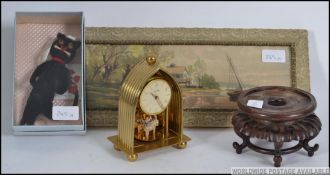 A vintage Bentima mantel clock together with a print,