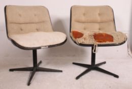 A pair of retro Scandinavian influenced swivel chairs,
