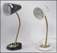 A pair of vintage 1970's gooseneck anglepoise desk lamps. One in white, the other black.