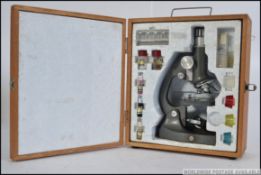 Lunax 50 - 120 X . 1960's boxed microscope with packing and all accessories included .