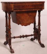 A Victorian walnut workbox having marquetry inlaid details with fabric box to the underside.