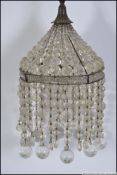 A vintage glass mid cenutry empire glass droplet metal framed chandelier light fixture,