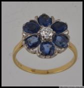 A hallmarked 18ct gold diamond and sapphire ring with approx 150pts of oval cut sapphires with
