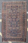 An early 20th century Bokhara rug having central medallion design with red, beige and blue borders.
