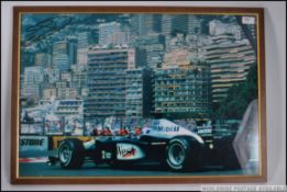 A framed and glazed signed photograph of David Coulthard racing for McLaren in the MP4 / 13 Formula