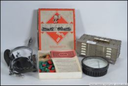 A dealers lot to include a pair of nickel spurs, a Mazak cast desk top cigarette box,
