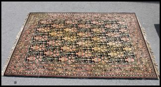 A 20th century black ground bokhara rug having central medallion design ( see illustration )