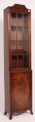 A fine quality Georgian revival flame mahogany thin cabinet having cupboard to the base with