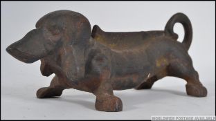 A possible late 19th early 20th century cast iron boot scrap in the form of a Dachshund dog.
