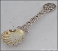 A believed Chinese silver caddy spoon with oyster shell bowl,