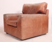 A good quality contemporary 20th century full grain brown leather armchair.
