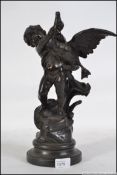 A bronze figurine of a cherub puttti and swan being raised over socle plinth base bearing the