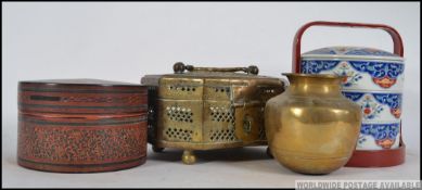 A collection of Asian ( Chinese / Indian ) food carriers to include Tiffin,