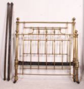 A Victorian large brass double bed complete with the runners.