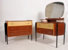 A stunning pair of 1950's chests / dressing chest of drawers being raised on ebonised exposed