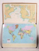 Two large framed wall maps - world map, and Plymouth. Both framed. Measures: 87cm x 123cm.