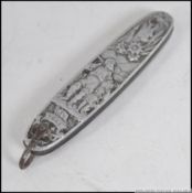 A silver white metal continental fruit / pen knife, heavily decorated with classical scenes.