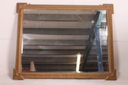 A 19th century large moulded gilt framed wall mirror.