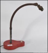 A vintage mid century goose neck anglepoise desk lamp raised on unusual shaped metal plinth base.