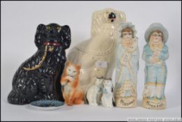 A collection of 19th and 20th ceramics to include Staffordshire flatbacks / dogs,