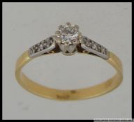 An 18ct gold and diamond solitaire ring with central diamond approx 20pts.