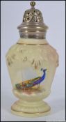 A Locke & Co Worcester sugar caster having a rococo silver plated finial topped cover with star