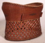 An early 20th century large woven childs crib,