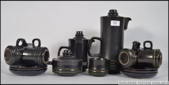 A retro stoneware Denby coffee service dating to 1971, consisting of six cups and saucers,