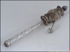 AN INTERESTING TIBETAN PRAYER RATTLE IN SILVER METAL,