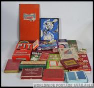 A collection of vintage games and playing cards to include: Scrabble, Lexicon, Canasta,