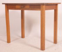 A vintage retro 1960's kitchen table with red formica top over beech wood frieze frame having