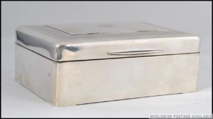 An Edwardian Sampson Mordan & Co silver hallmarked table top cigarette case with engine turned lid,