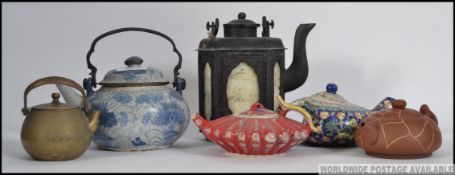 A good collection of Chinese 20th century teapots of various design and styles to include