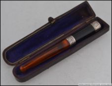 A late 19th century continental leather cased Cheroot holder,