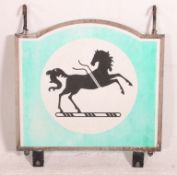 A vintage wall mounted advertising swing sign on the original bracket for Lloyds bank.