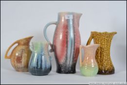 A collection of art deco and later ceramic jugs by Sylvac,