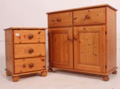 A 20th century antique style pine sideboard cabinet with cupboards and drawers together with a
