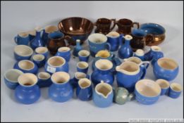 A collection of Devonmoor mottoware together with a collection of ceramic lustre wares all dating