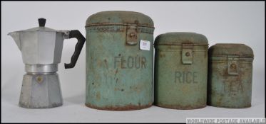 A set of vintage enamel graduating storage jars along with an Italian stove top percolator.
