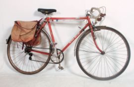 A retro Claud Butler Cresta Reynolds 531 road bike in the original orange finish paint,