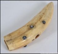 An early 20th century marine ivory tusk corkscrew handle with inset studs ( see illustrations).