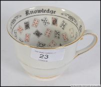 A vintage 20th century fortune tellers porcelain teacup - cup with decorative glazed inner and