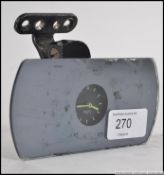 A vintage 20th century Smiths M.A. rear view mirror with inset clock.