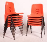 A collection of 11 vintage retro plastic School Hille stacking chairs,