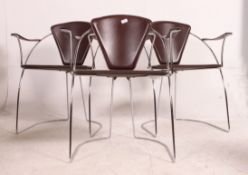 A set of three 20th century Italian chromed framed and leather dining chairs, having leather pads,