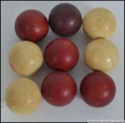 A collection of nine 19th century Ivory ? billiard balls, four white with five red balls, 4.