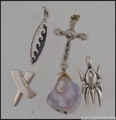 A collection of 5 silver 925 / sterling marked necklace pendants to include spider, wave, crucifix,