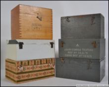 A collection of vintage wooden boxes, mainly of military origin ,