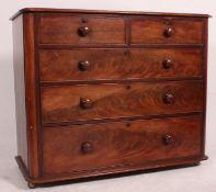 A Victorian mahogany 2 over 3 chest of drawers having flared top over 2 short and 3 deep drawers
